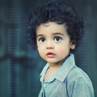 Young Child Digital Portrait with Blue Eyes and Curly Hair