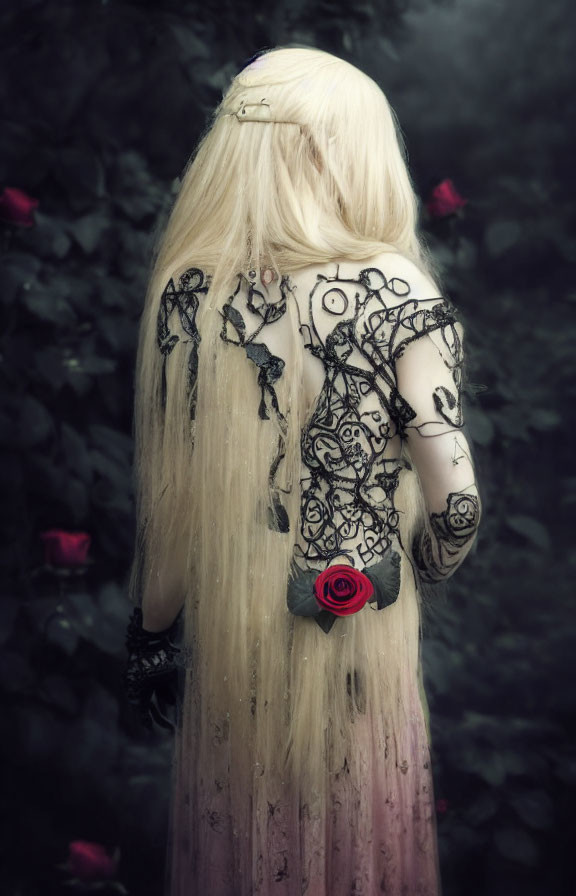 Blonde person with black designs holding a red rose in misty setting