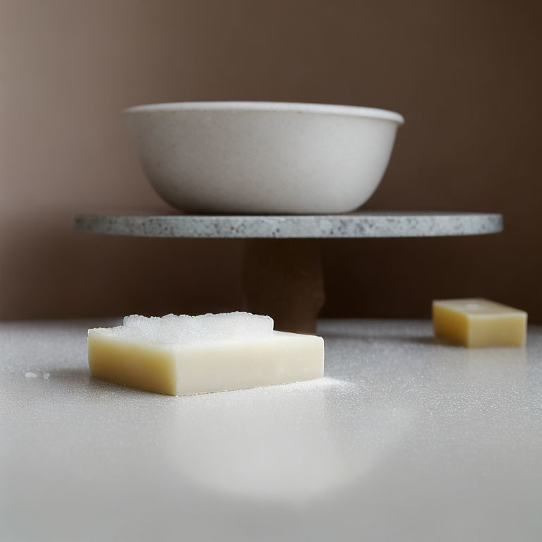 Bowl on stone slab with sugar and butter blocks