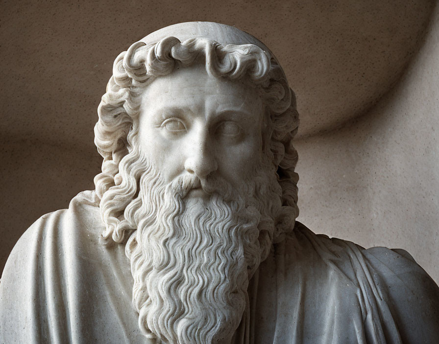 Marble sculpture of bearded man with curly hair and thoughtful expression