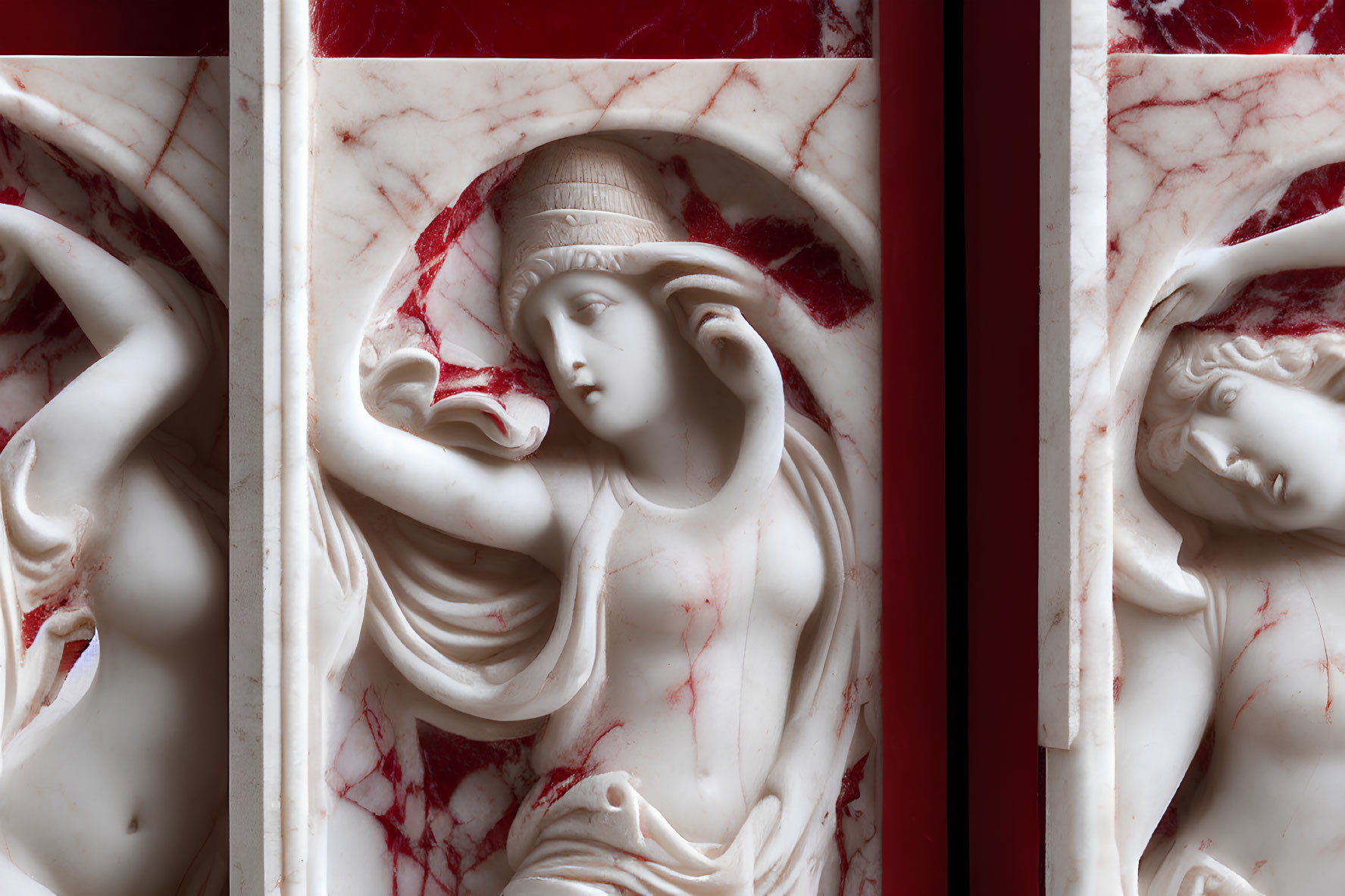 Marble bas-relief of elegant female figures with red marble columns