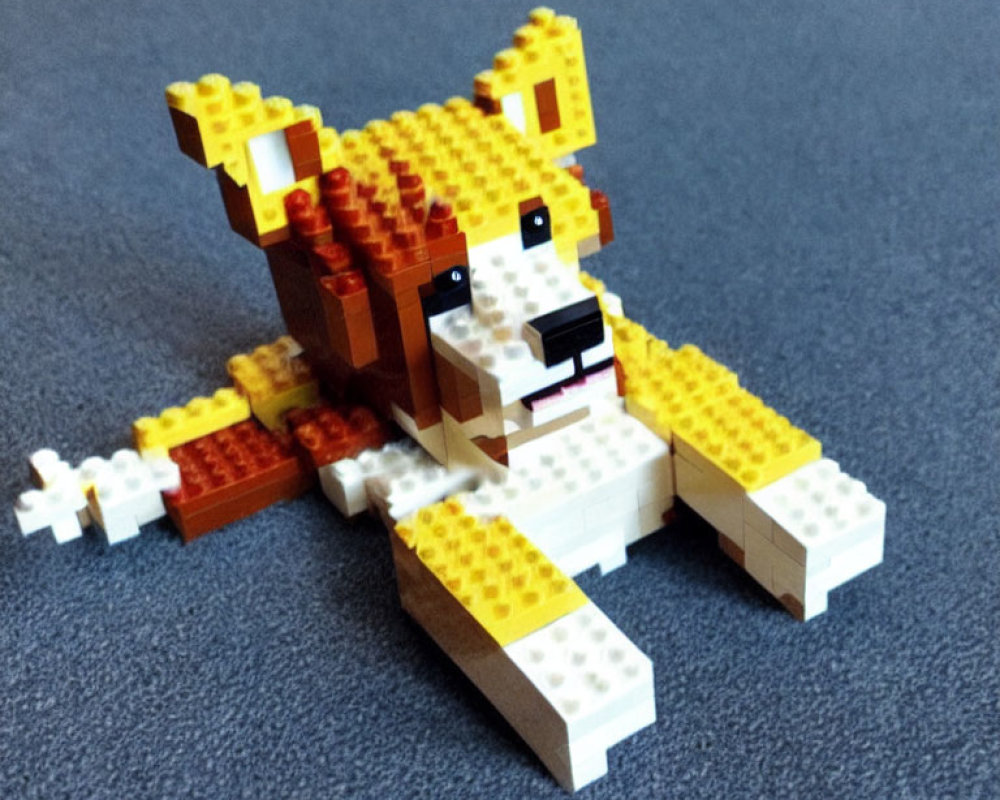 Yellow and Orange Lego Dog Model on Blue Background