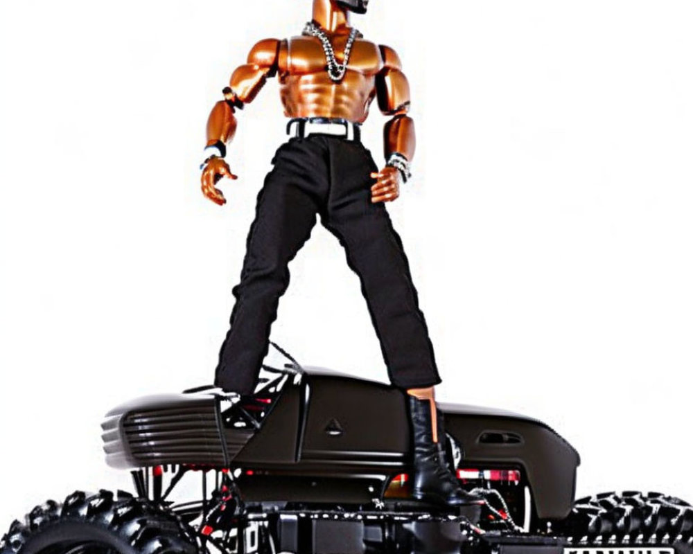 Muscular action figure on black RC monster truck with sunglasses and chains