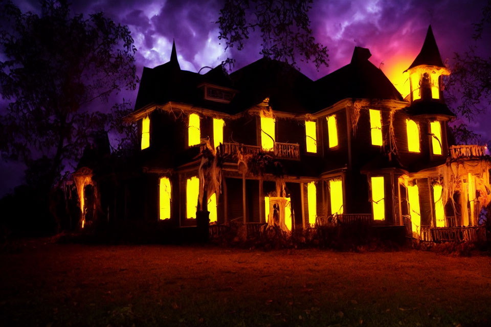 Spooky Victorian-style house at night with purple sky