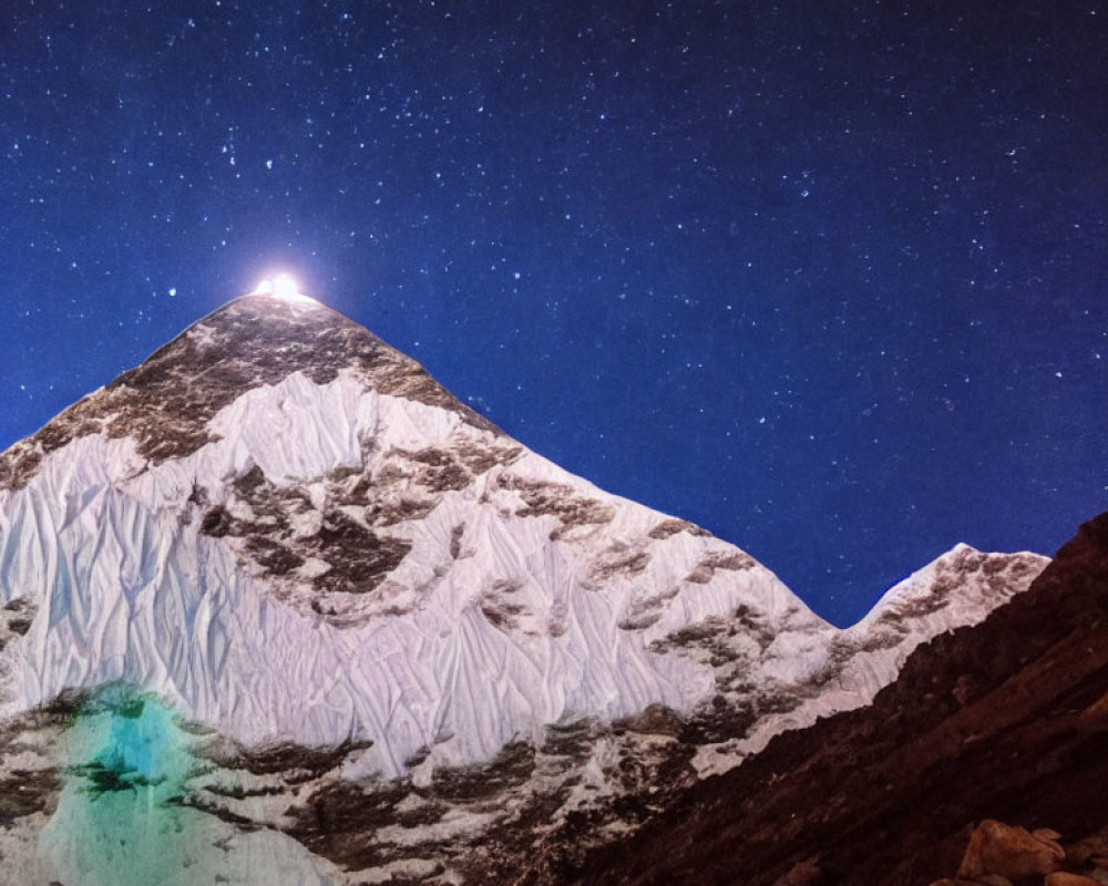 Snow-Capped Mountain Peak under Starry Sky with Bright Star and Greenish Glow