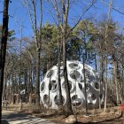 Futuristic spherical structure with round windows in snowy forest