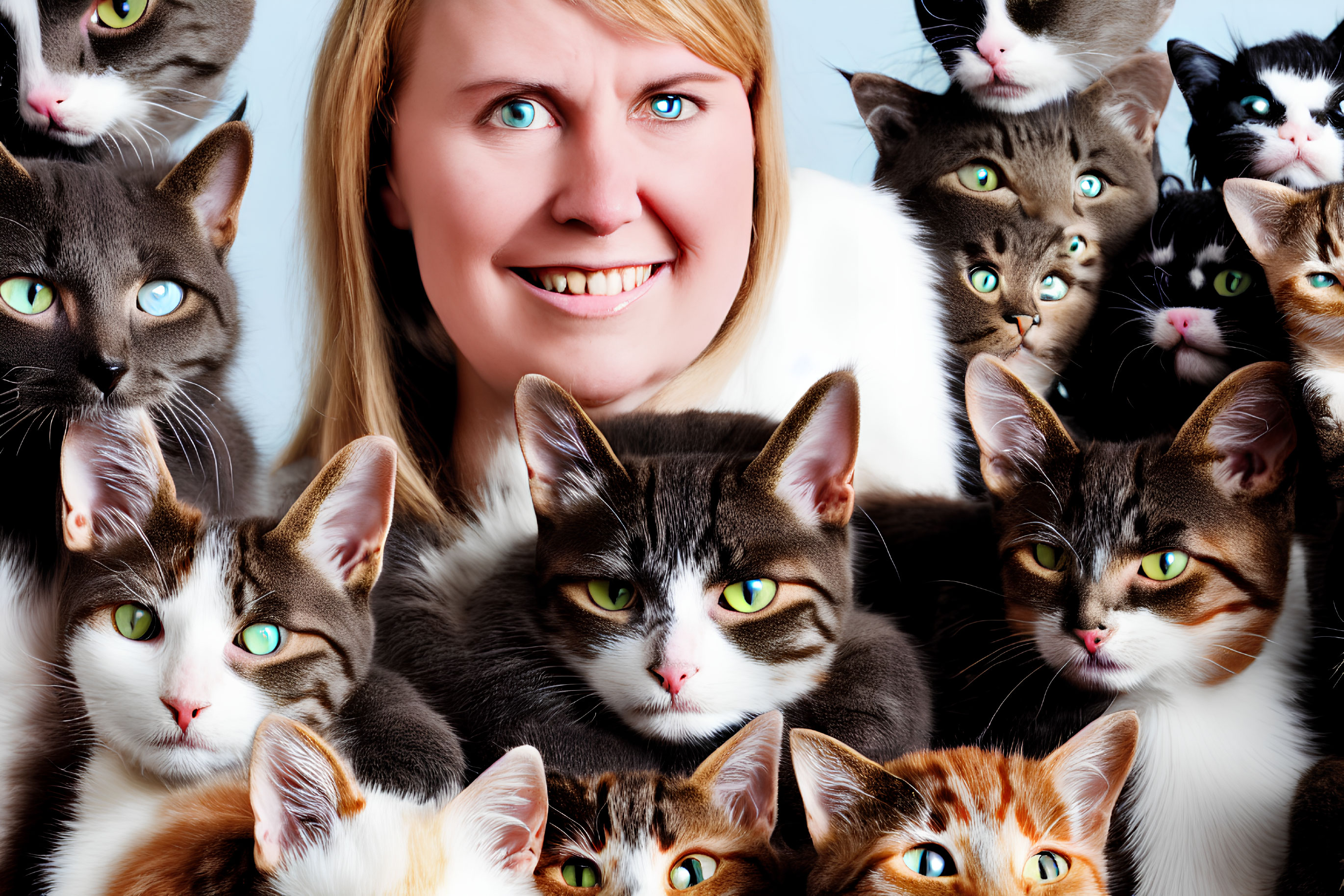 Smiling woman with multiple patterned cats in a photo
