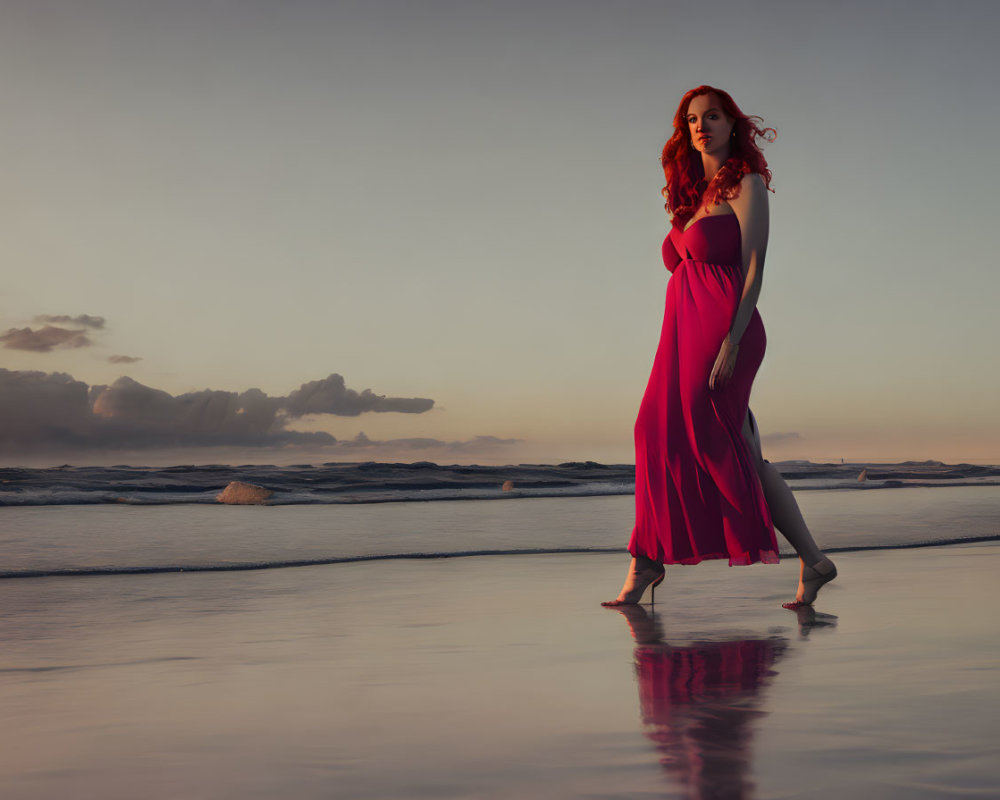Woman in Red Dress Standing on Beach at Sunset with Reflection