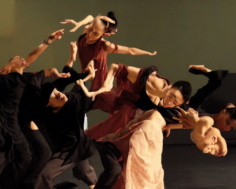 Group of dancers performing fluid contemporary routine