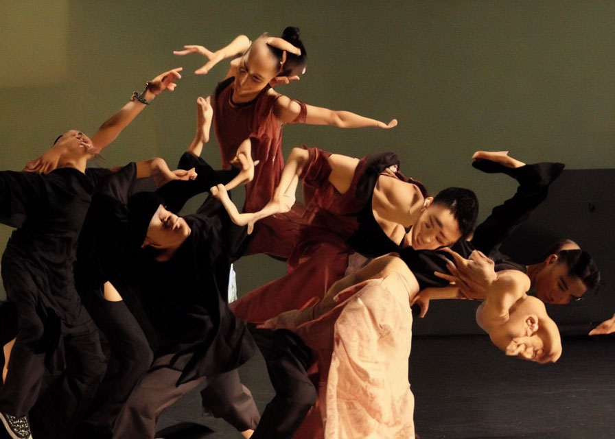 Group of dancers performing fluid contemporary routine