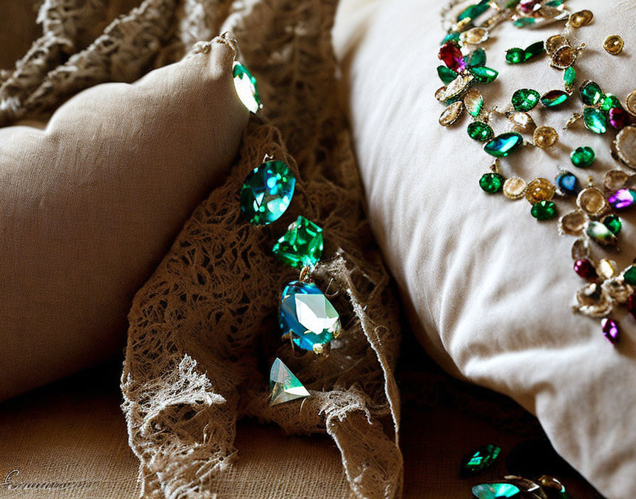 Intricate lace and colorful gemstone embellishments on elegant fabric