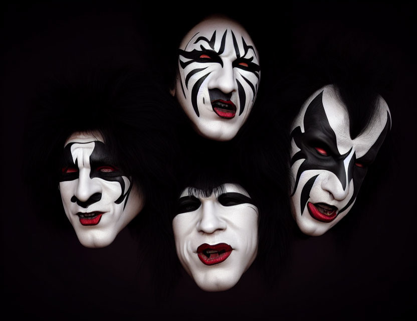Four individuals in black and white face paint on dark background