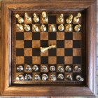 Luxurious Chess Set with Gold and Silver Flower Pieces on Decorative Background