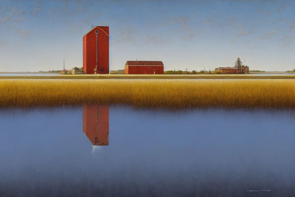 Red Grain Elevator Reflected in Blue Water with Barn and Silos