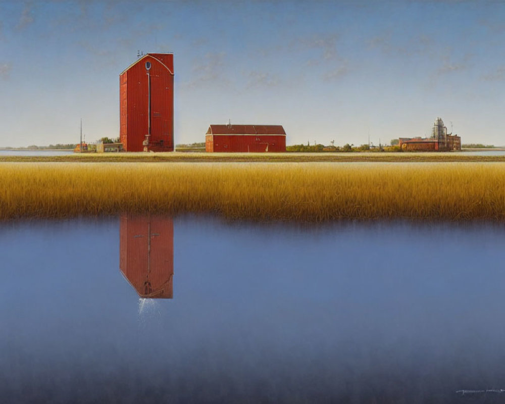 Red Grain Elevator Reflected in Blue Water with Barn and Silos