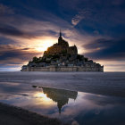 Twilight view of Mont Saint-Michel with star reflection