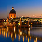 Cityscape at Dusk: Arched Bridge, Reflecting Lights, and Domed Buildings