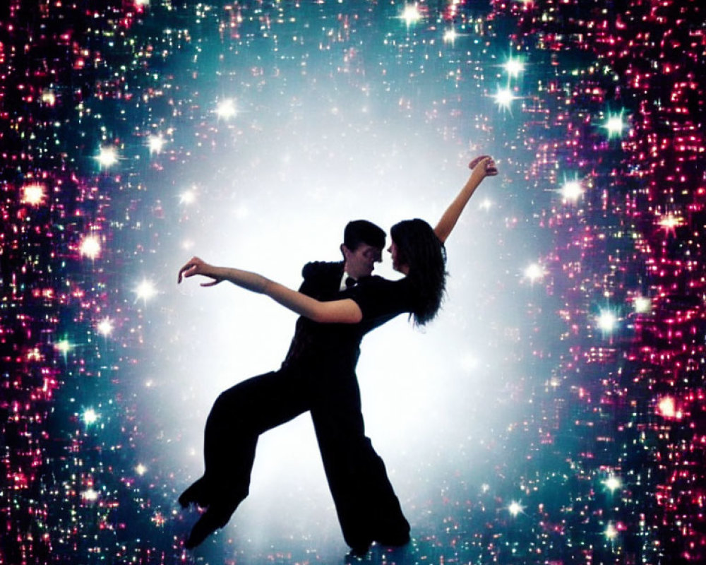 Man and woman in dance pose against starry space background