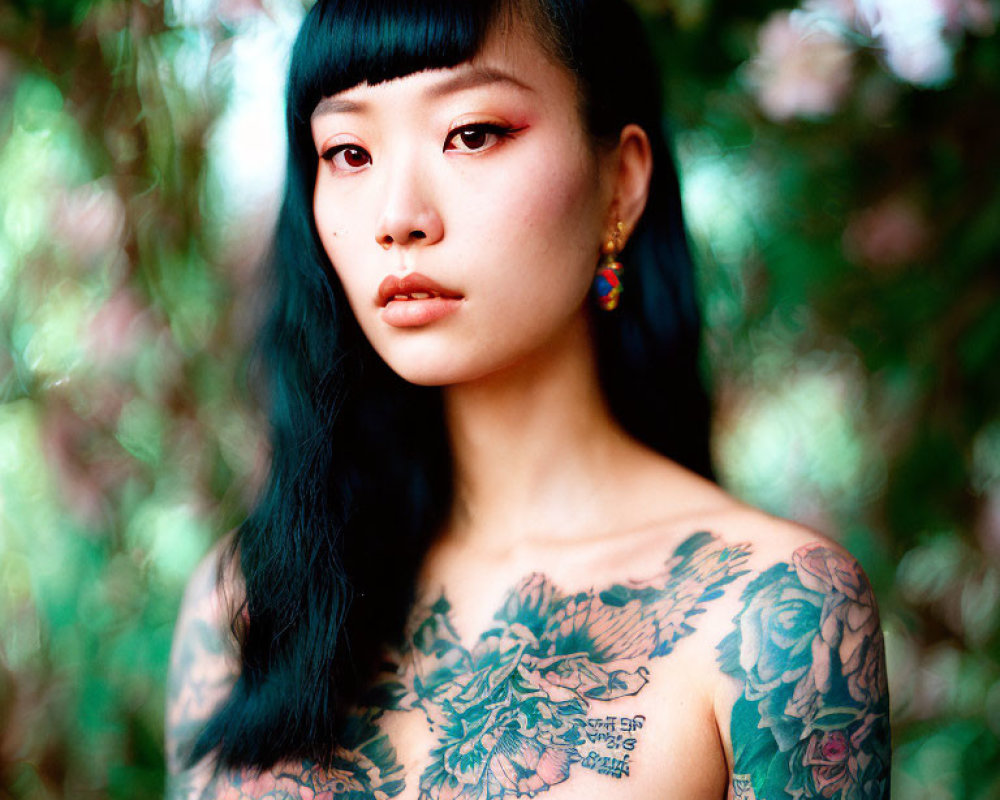 Woman with Floral Tattoo on Chest and Shoulder in Green Foliage