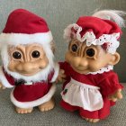 Charming Santa and Mrs. Claus in Red Christmas Outfits