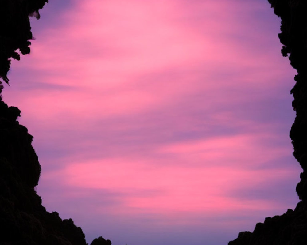 Colorful Pink and Purple Sky Through Cave Silhouette