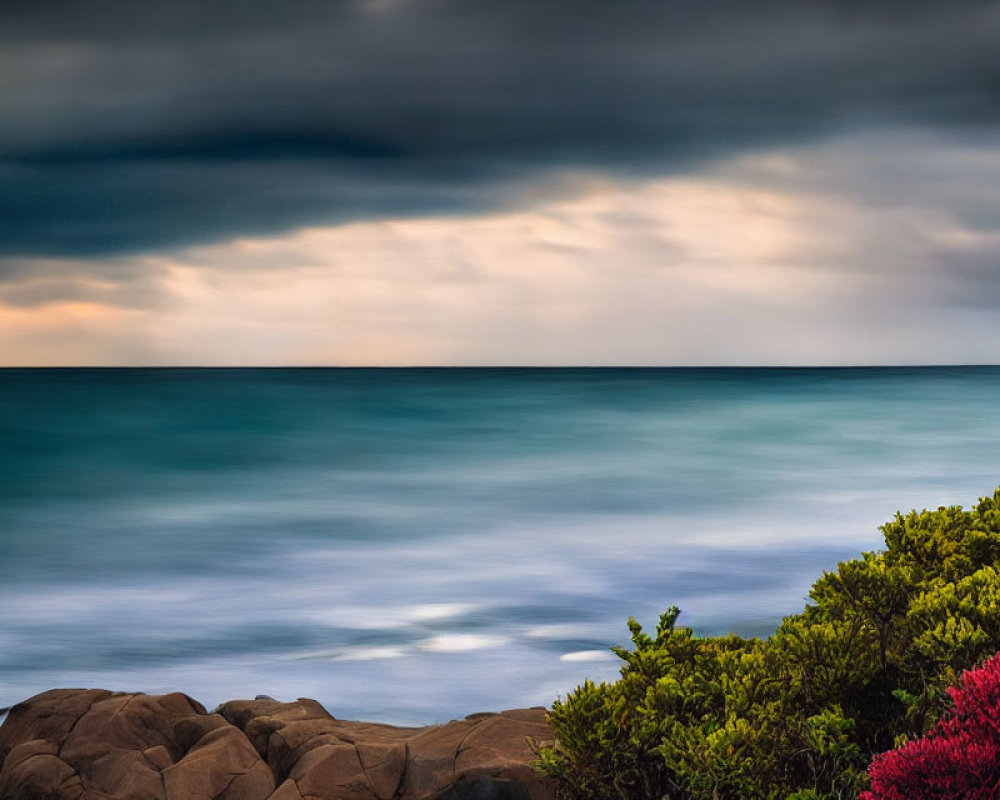 Tranquil seascape with dramatic sky and rocky coastline