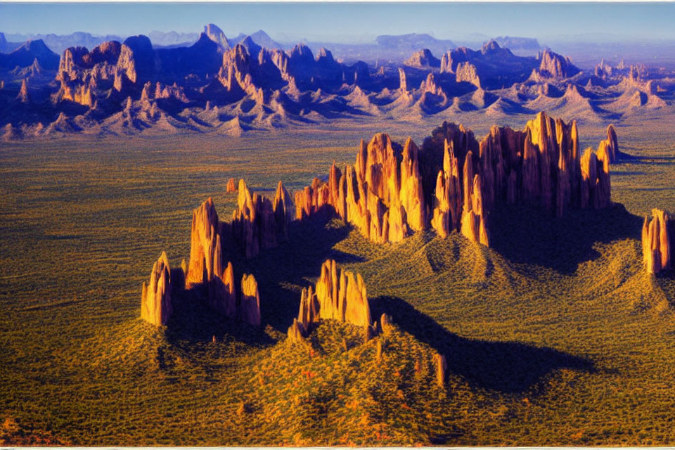 Desert Landscape with Towering Rock Formations at Sunrise