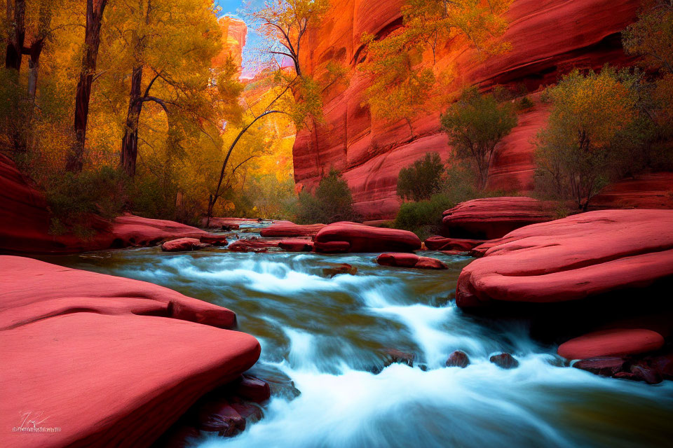 Tranquil river in red rock canyon with fall foliage