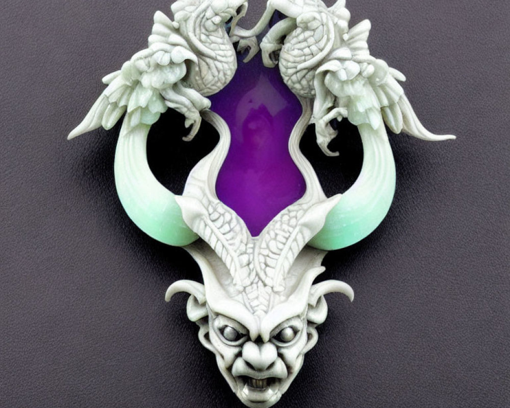 White Jade Pendant with Dragons, Purple Gemstone, and Demon Face on Black Background