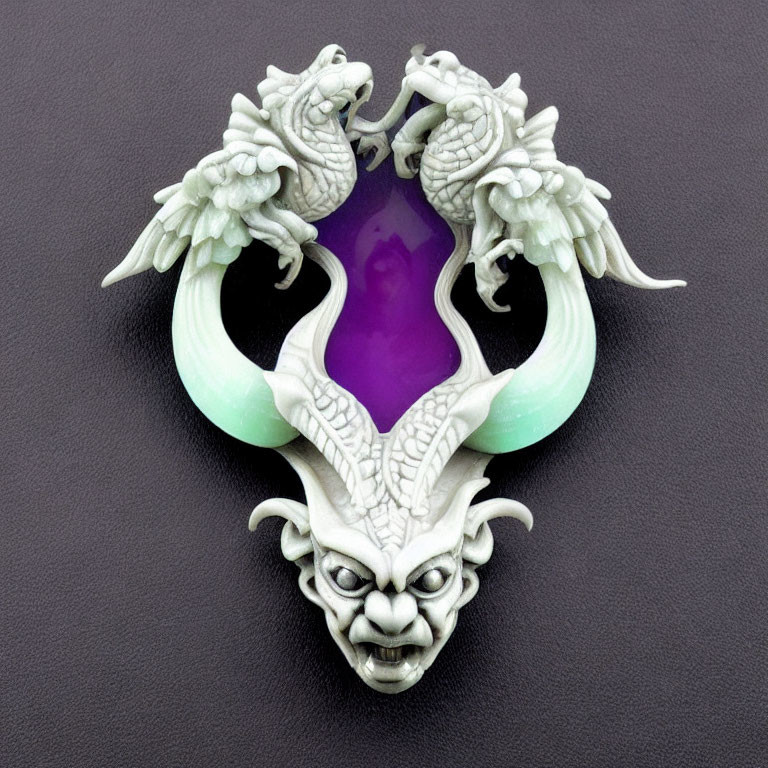 White Jade Pendant with Dragons, Purple Gemstone, and Demon Face on Black Background
