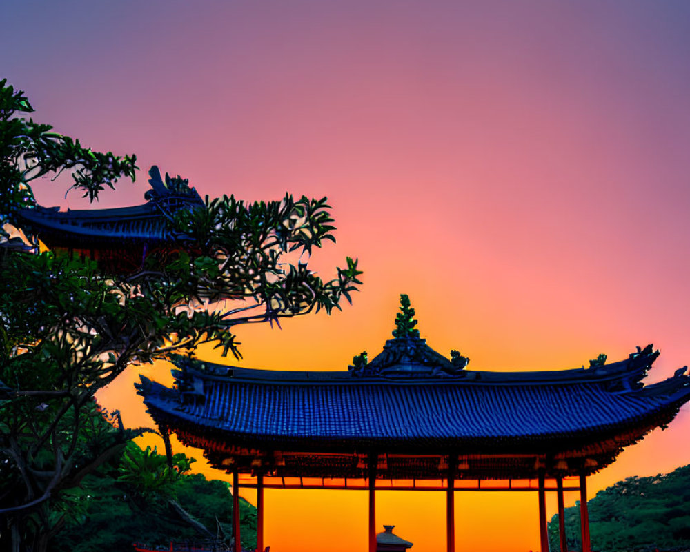 Colorful Asian-style pavilion at sunset with pink and orange hues and lush greenery