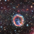 Colorful Nebula Surrounded by Stars in Deep Space
