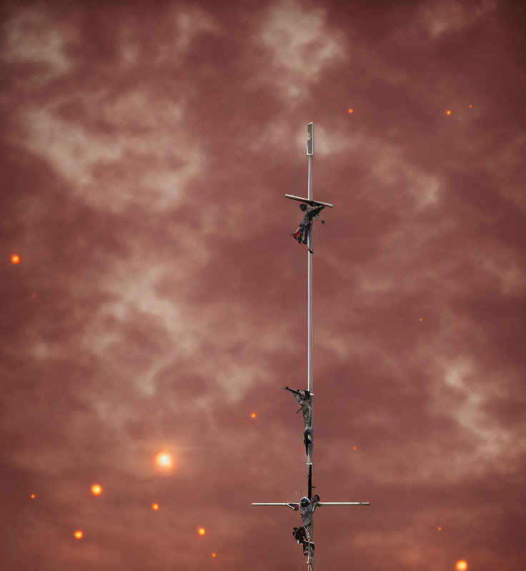 Vertical Antenna with Multiple Transceivers Against Red Cloudy Sky