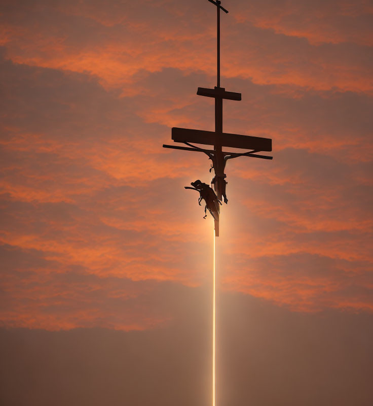 Silhouette of Crucifix with Jesus in Fiery Sky & Beam of Light