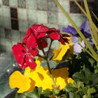 Colorful Flowers by Calm Waters: Red, Yellow, and White Blooms with Green Foli