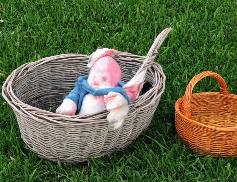 Colorful Stuffed Rabbit in Large Wicker Basket on Green Grass