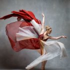 Graceful dancer in vibrant floral dress mid-twirl