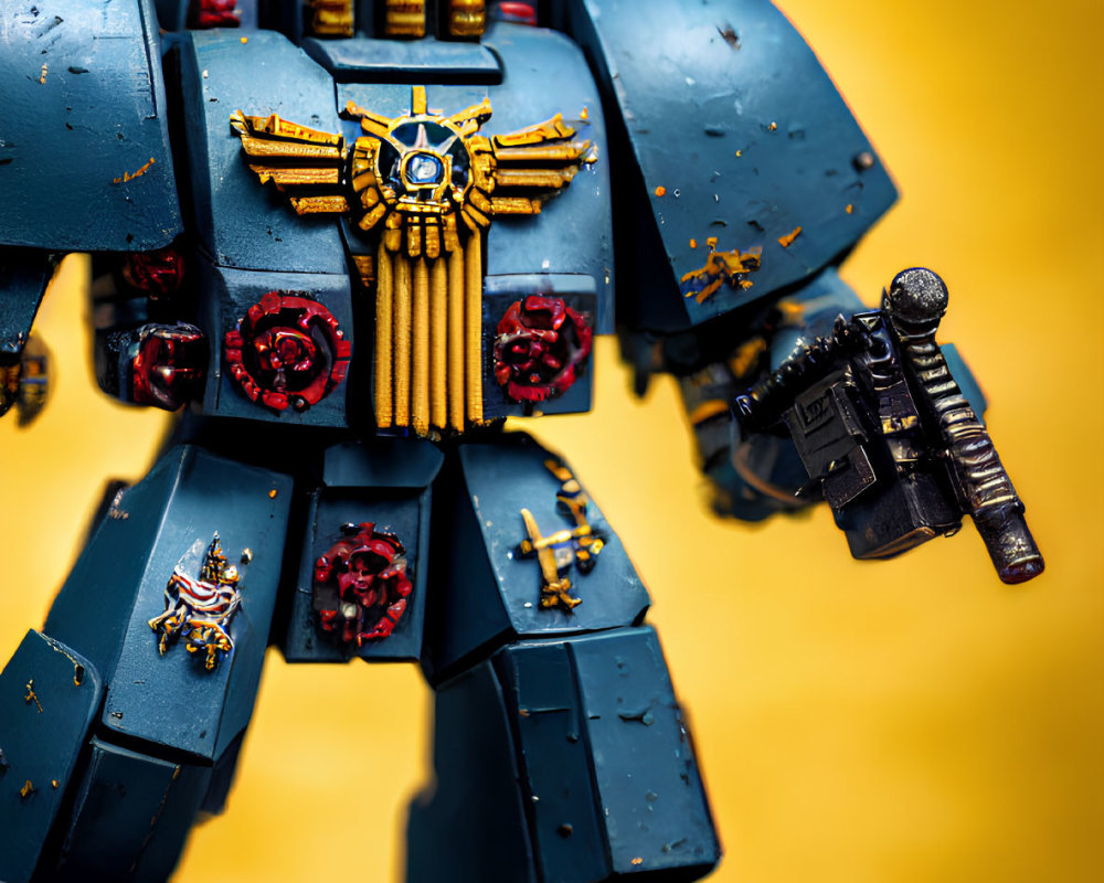 Detailed Blue and Gold Mech Suit Miniature on Vivid Yellow Background