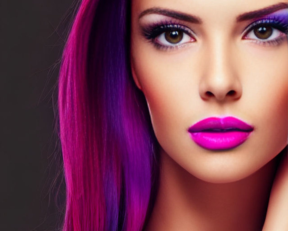Portrait of woman with purple hair and bold makeup on grey background