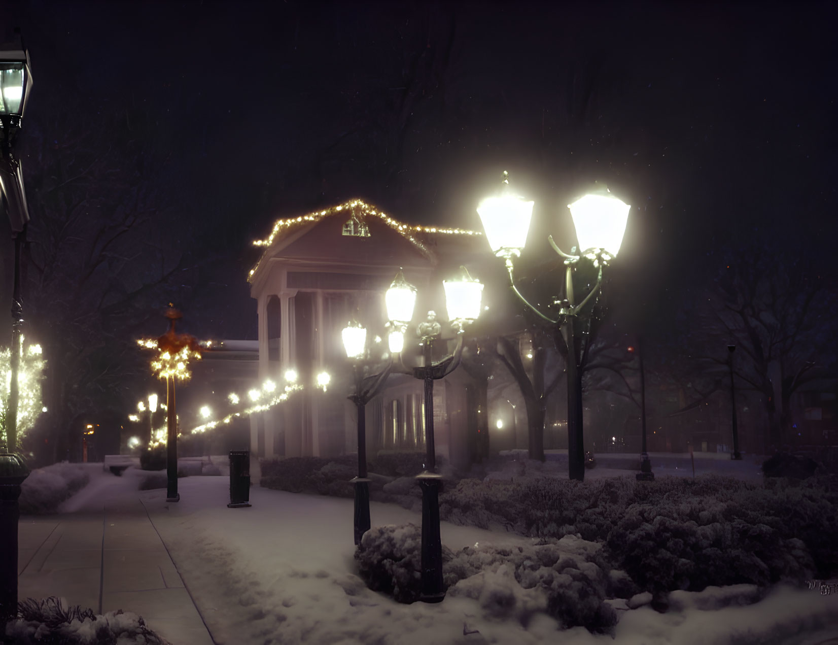 Snowy Winter Dusk Scene with Decorated Lamp Posts