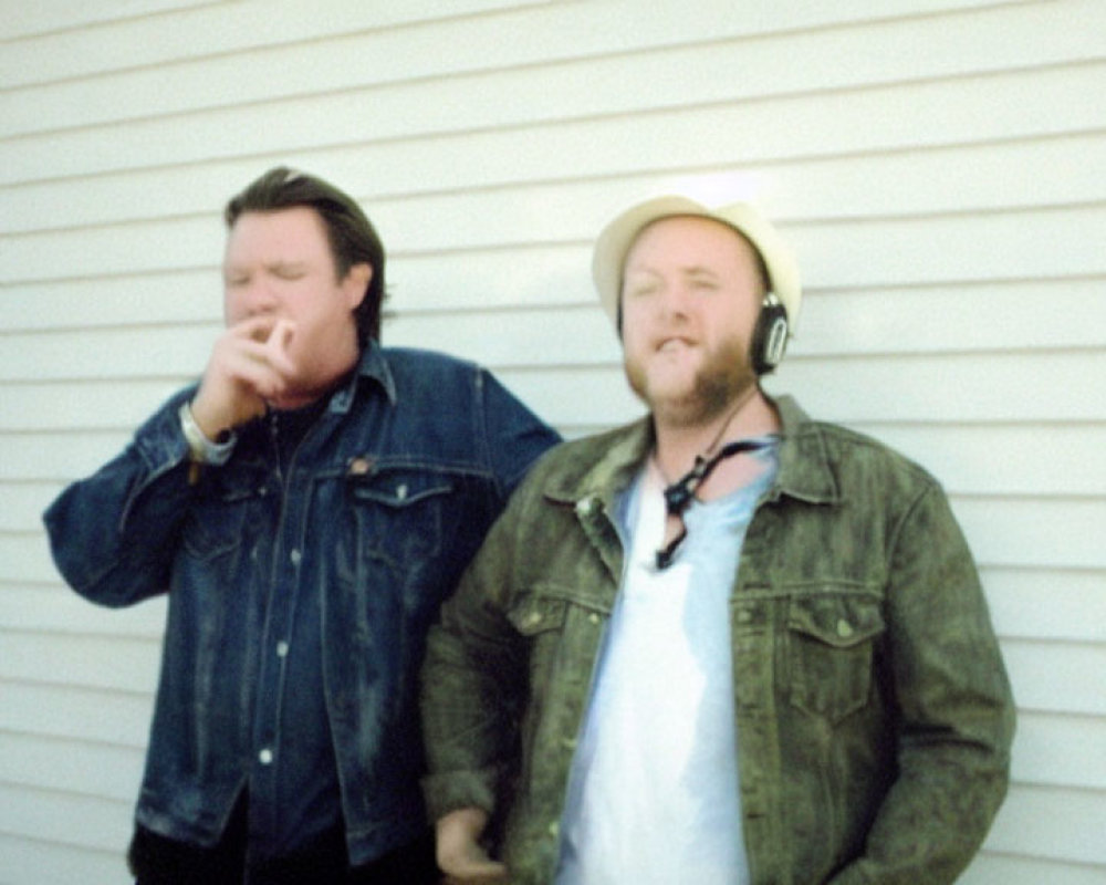 Blurred photo of two men in casual jackets