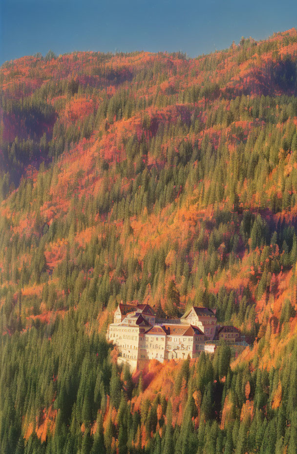 Secluded castle in vibrant autumn forest landscape
