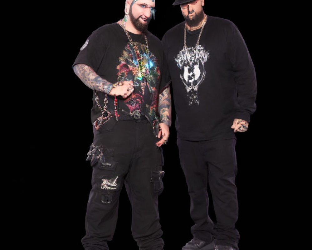 Two Men in Black Graphic T-shirt and Hoodie with Tattoos and Chain Accessories