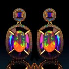 Gold-framed Earrings with Purple Gemstones and Opals on Black Surface