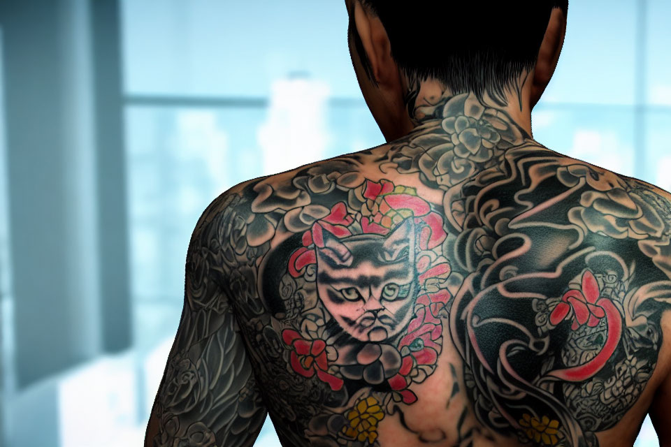 Tattooed back with cat-like figure and floral designs in room.