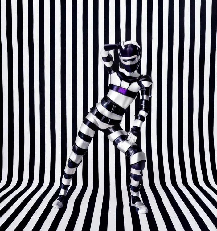 Purple and white striped bodysuit against black and white striped background.