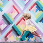 Colorful Surreal Landscape with Levitating Girl and Geometric Shapes