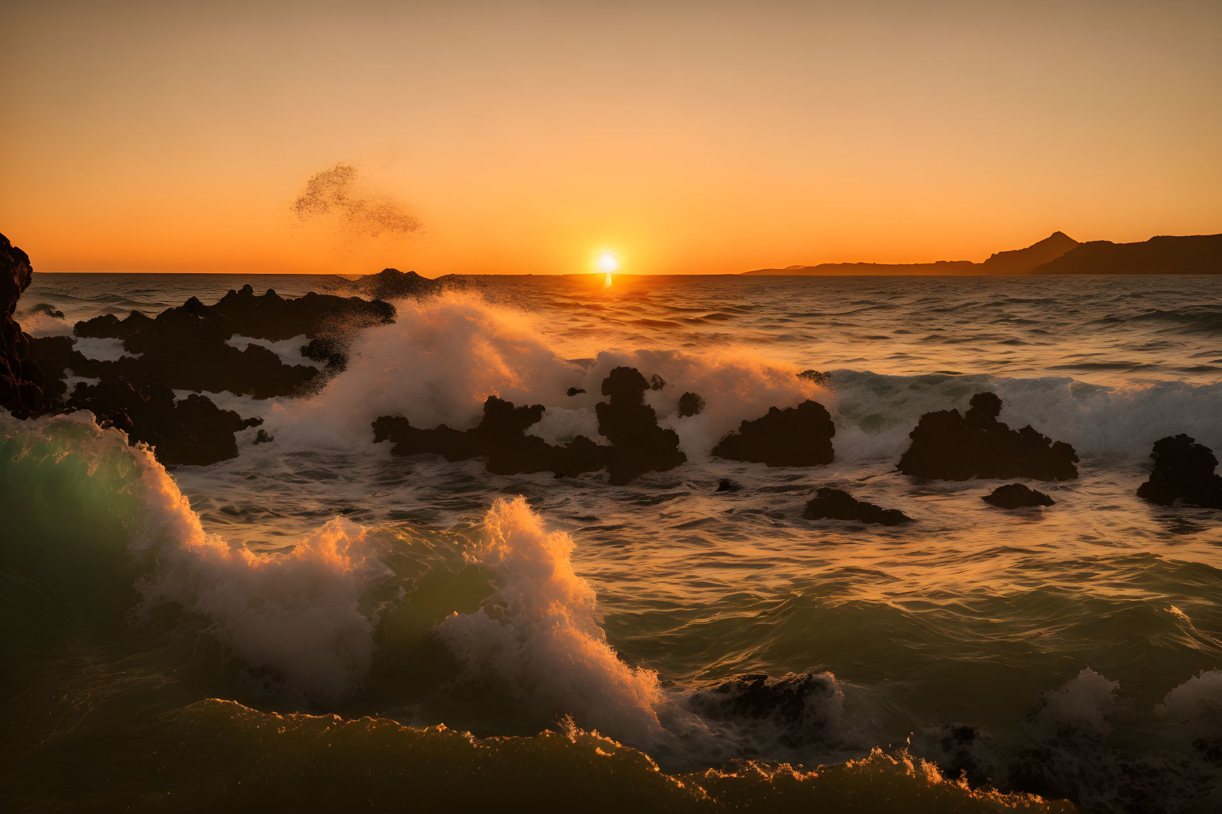Sea waves with sunset and some volcanic rocks is a