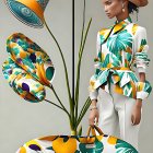 Two models in floral designs against pastel backdrop