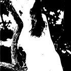 Monochromatic nude female figure leaning on a tree in high-contrast art